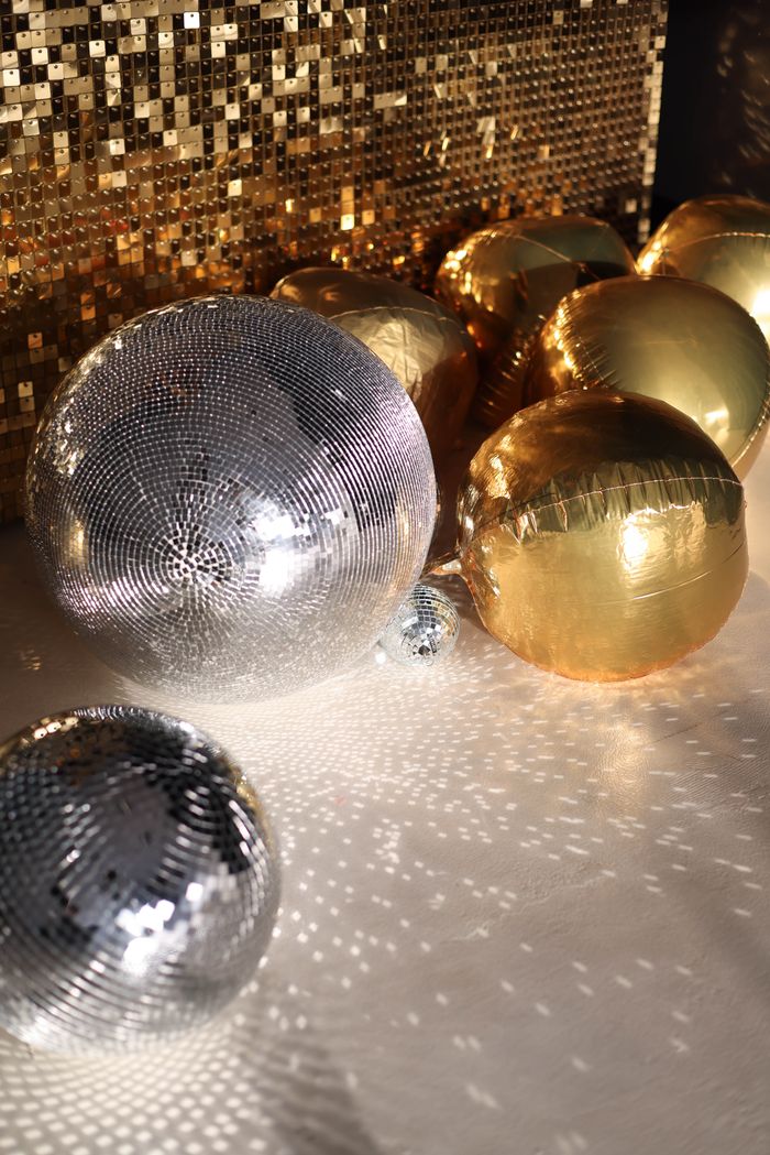 Silver and gold balloons creating a sparkling festive atmosphere, perfect for celebrations and parties.